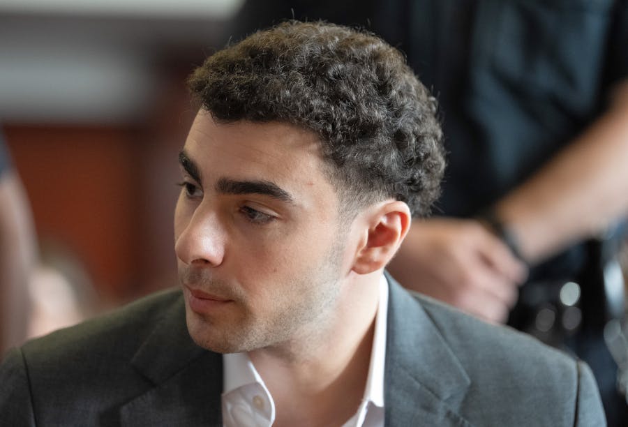 Luigi Mangione talks to one of his lawyers in Manhattan Supreme Court on Tuesday, Aug. 11, 2026, in Manhattan, New York. (Barry Williams/New York Daily News/Pool/TNS)