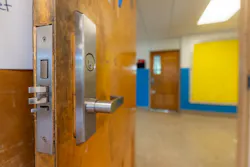 Classroom door hardware must account for both security and life-safety requirements, underscoring the need to coordinate fire alarm, access control and lockdown systems during design and commissioning.
