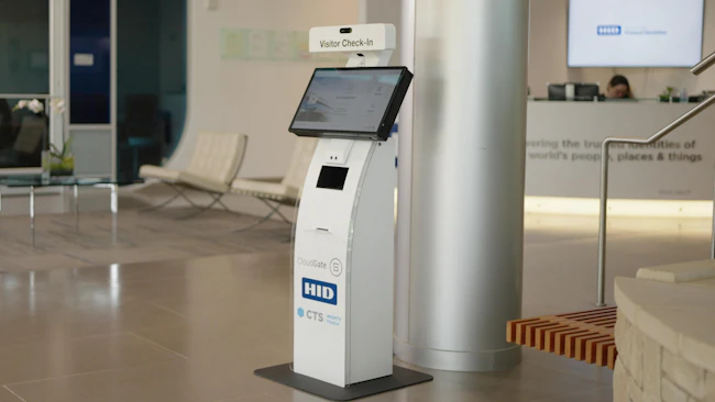 HID technology is integrated into a CTS self-service kiosk to support document authentication and facial verification during visitor check-in.