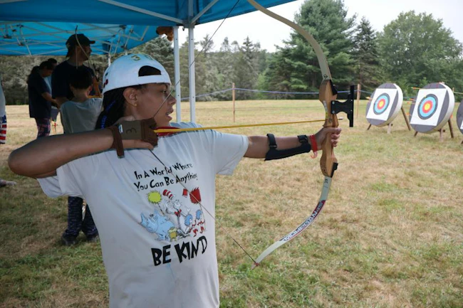 A young participant takes part in an archery activity at Children&rsquo;s Burn Camp, which will receive support from funds raised during the Fire & Security Executive Club&rsquo;s annual dinner Nov. 2 in New York City.