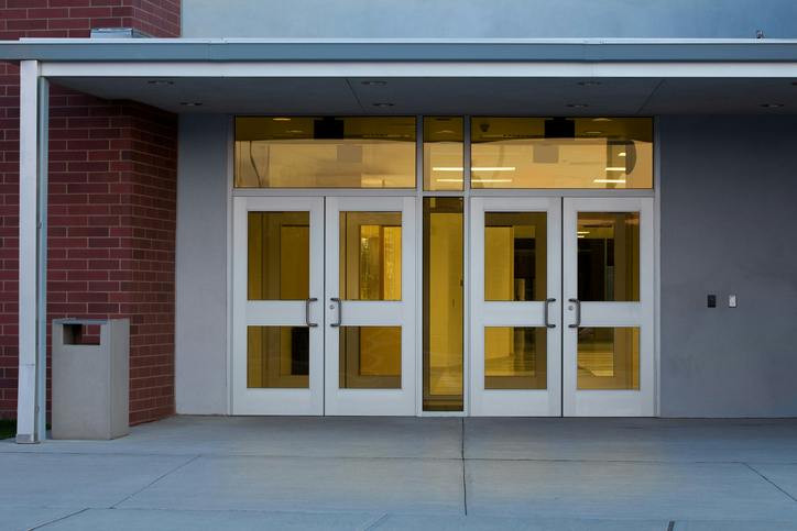 Locked school entrances with glass panels can present vulnerabilities that conventional access-control measures alone may not address, a concern underscored by the shootings at Sandy Hook and Silver Rail elementary schools.